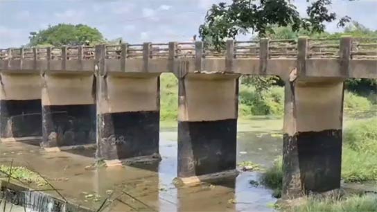 Thousands of ordinary people cross the dilapidated bridge