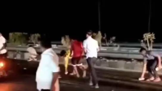 People ran to Collect Scattering Cash in Highway