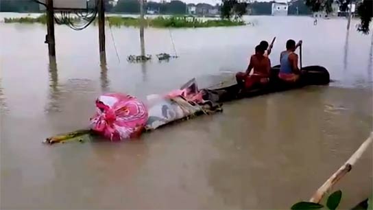 Dead body is being taken to the crematorium on a raft in Ghatal