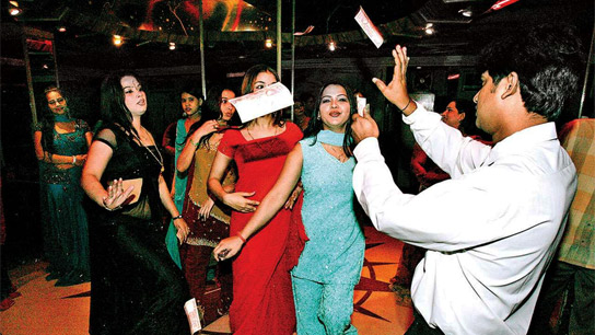 People sitting in front of the dance floor are being openly targeted