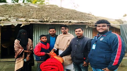 Swapna Choya Volunteer Youth Organization distributes winter clothes to an orphan child in Amtali