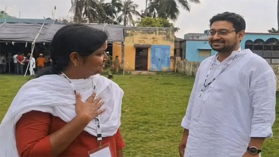 Meenakshi in a frame with the top with a sweet smile