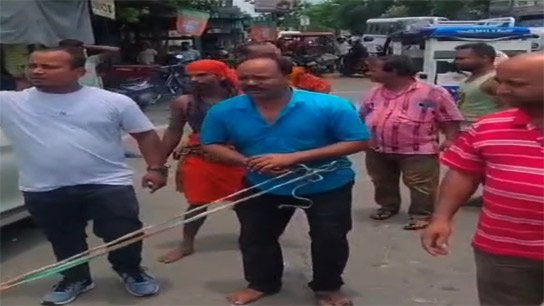 Trinamool worker parades market with rope around waist in Cooch Behar's Ghughumari Bazaar! Eggs thrown at him