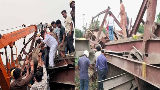 ক্রেন দিয়ে লোহার বিম সরিয়ে আহতদের উদ্ধারকাজ চলছে।