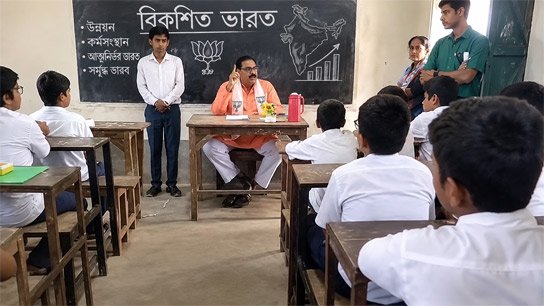 BJP leader speaks on 'developed India' issue while sitting on teacher's chair during class