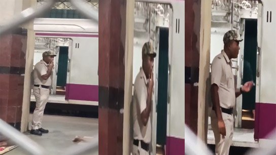 One rule for the common man and another for the police? Police officer smoking openly while on duty at Sealdah station!